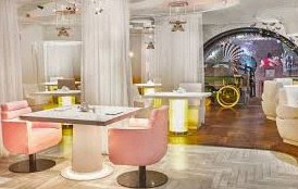 Bright dining room with pink chairs